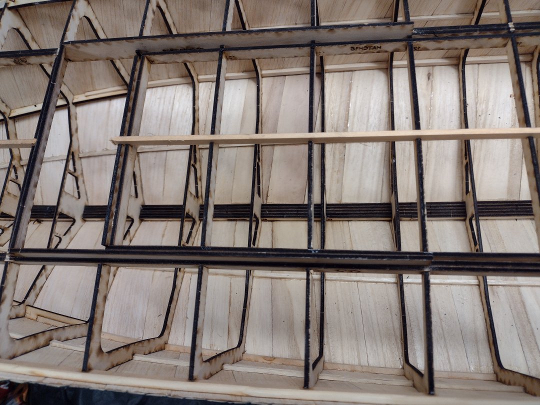 deck stringer at the fwd end of the hatch